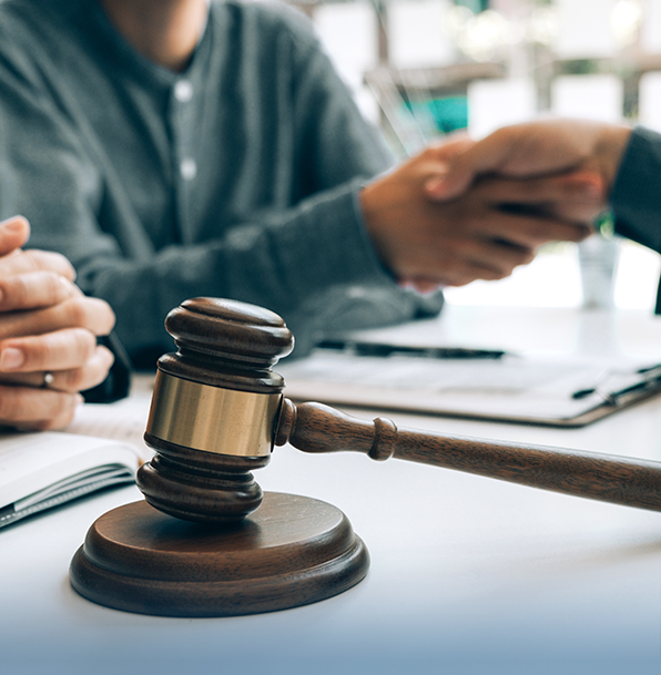 Gavel handshake legal consultation office