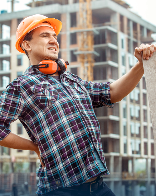 Construction worker experiencing back pain